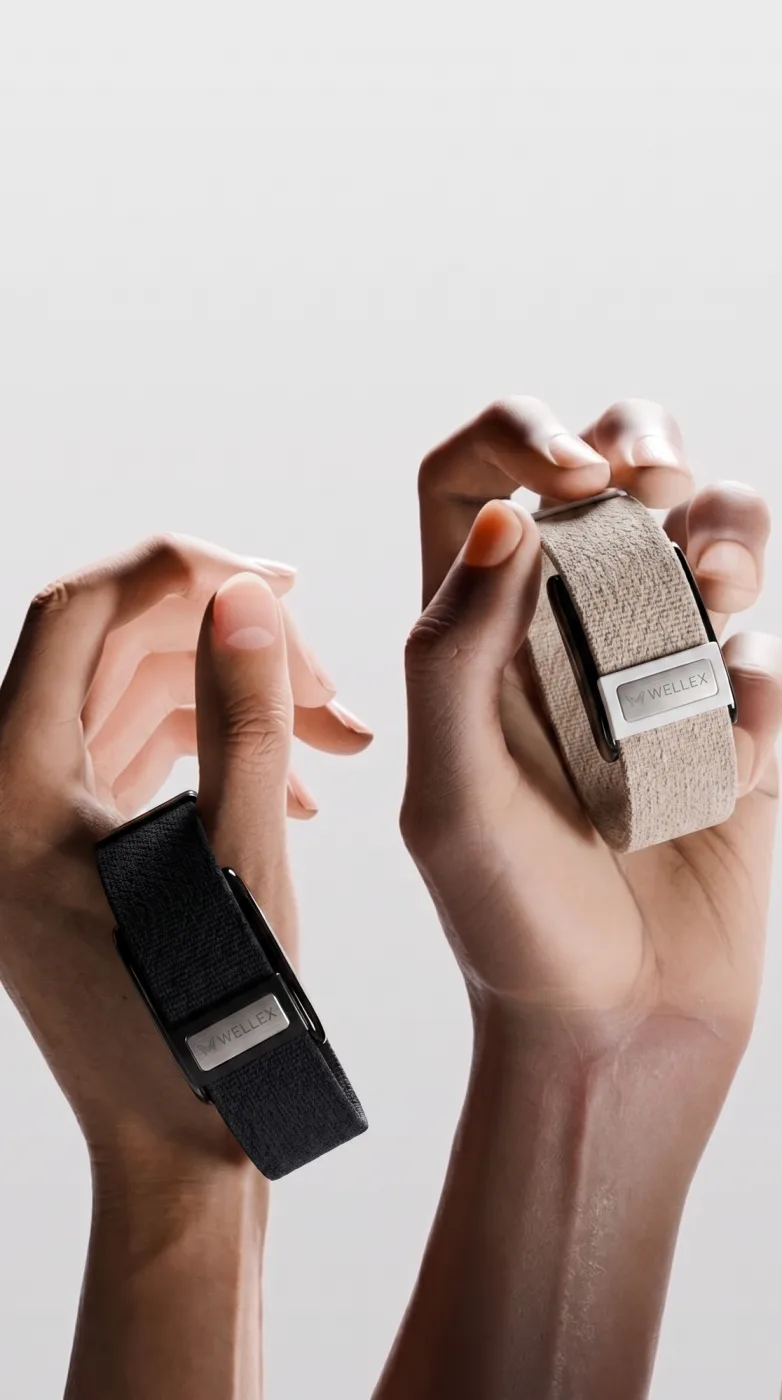 Two hands holding Wellex bands