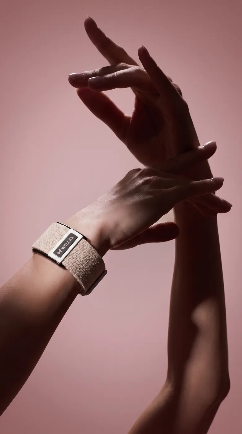 Two hands at rest, the band on one wrist