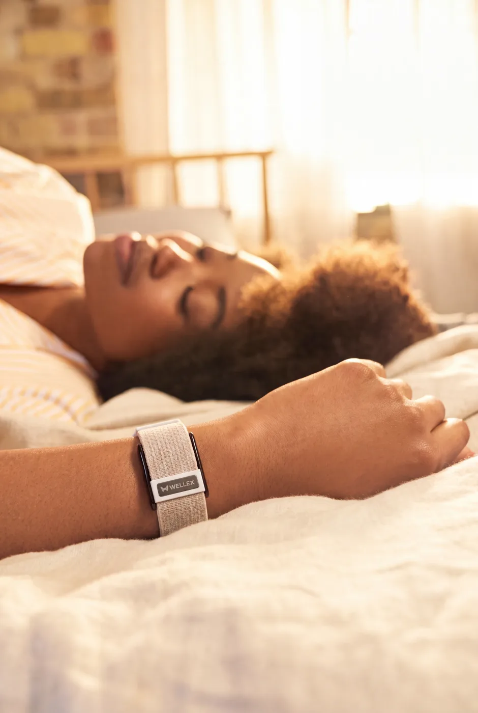 A woman asleep, a band on her wrist