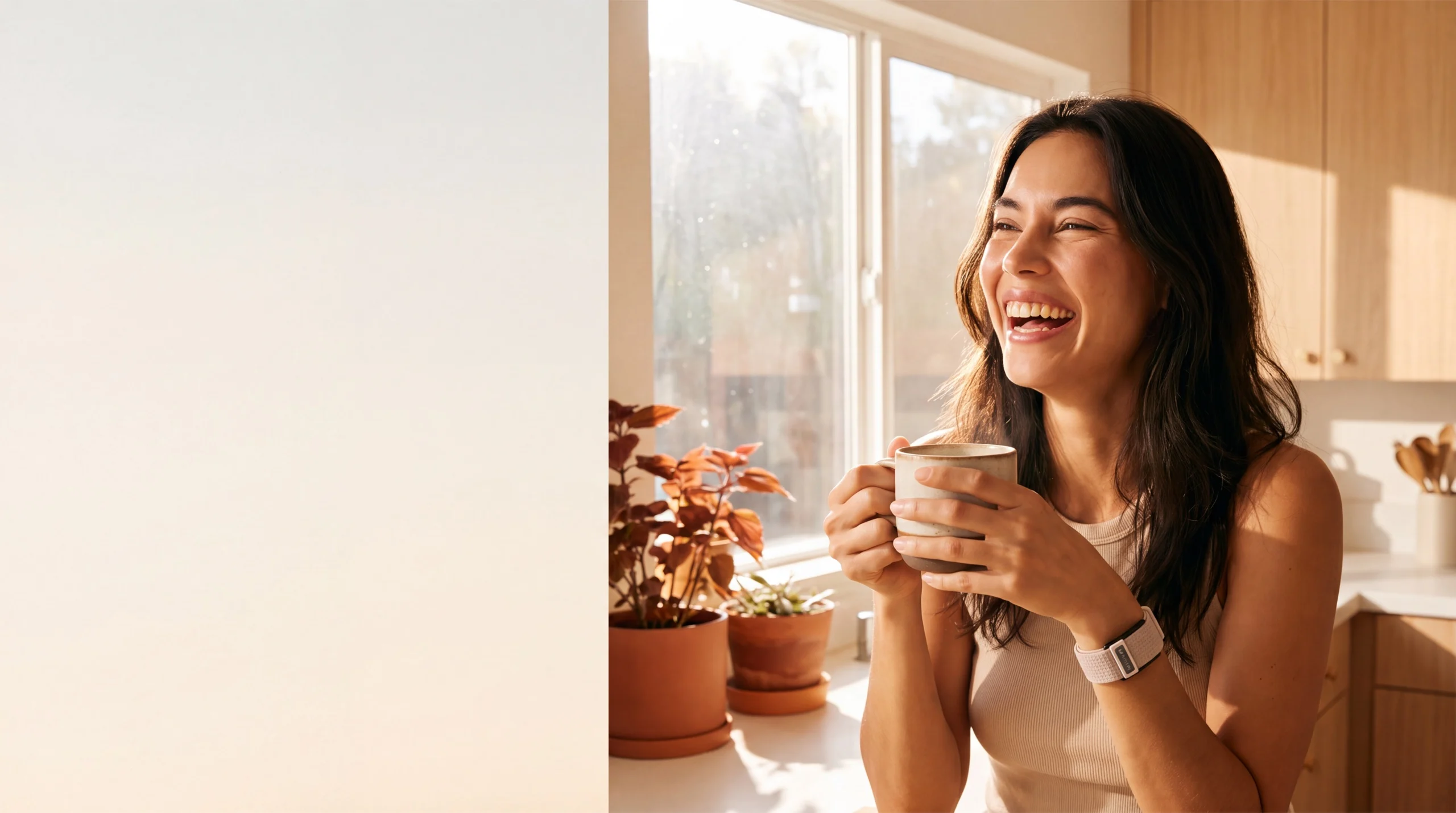 A woman laughing over her morning coffee, wearing the Wellex band